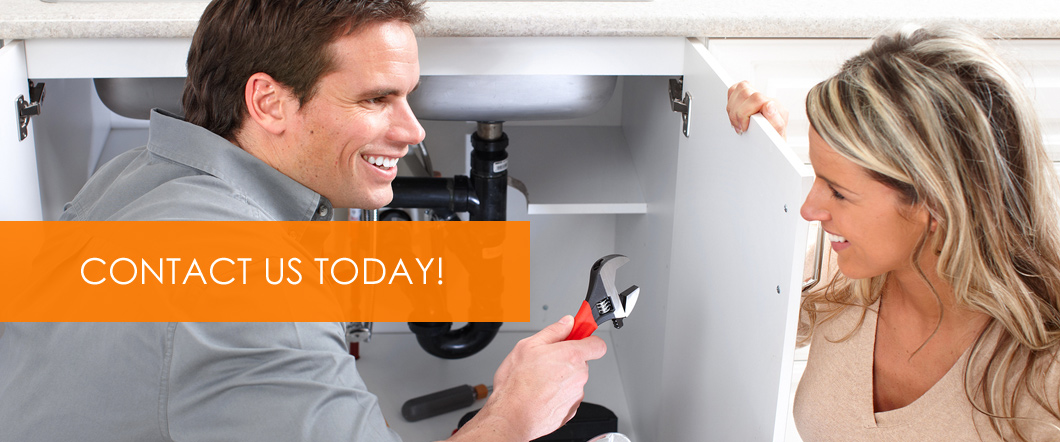 JC Plus Plumbing plumber repairing an under-sink drain in Lincoln, NE